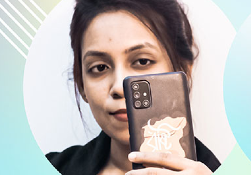 Woman taking selfie with phone case